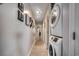 Bright hallway with stacked washer and dryer, decorative wall art, and neutral flooring at 1208 S Ocean Blvd. # H, North Myrtle Beach, SC 29582