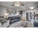 Living room/kitchen space with stainless steel appliances, beach decor, and light gray flooring at 1208 S Ocean Blvd. # H, North Myrtle Beach, SC 29582