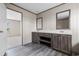 Bathroom features a double sink vanity with wood cabinets, white countertop, and decorative mirrors at 121 Forman Way, Aynor, SC 29511