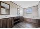 Bathroom showcases a double sink vanity, soaking tub, and a bright shower with glass doors at 121 Forman Way, Aynor, SC 29511