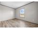 Neutral bedroom features a view from a window and light-colored wood floors at 121 Forman Way, Aynor, SC 29511