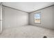 Cozy bedroom with neutral walls, plush carpet, a large window, and minimalist design elements at 121 Forman Way, Aynor, SC 29511