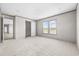 Spacious bedroom with carpet, walk-in closet, and natural light from two windows at 121 Forman Way, Aynor, SC 29511