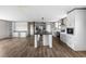 Open-concept layout features a bright kitchen with stainless steel appliances, a spacious island, and stylish cabinetry at 121 Forman Way, Aynor, SC 29511