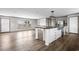 Open-concept living space featuring a kitchen with stainless steel appliances and a spacious island with bar seating at 121 Forman Way, Aynor, SC 29511