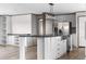 Bright kitchen features stainless steel appliances and a spacious island with bar seating at 121 Forman Way, Aynor, SC 29511