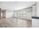 Open living space with wood-look flooring, natural light, neutral wall colors, and an open layout at 121 Forman Way, Aynor, SC 29511