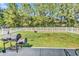Large backyard featuring well-kept lawn, fire pit, and a grill area at 122 Desurrency Ct., Georgetown, SC 29440