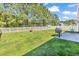 Picturesque backyard with green lawn, a fire pit, and a barbecue grill at 122 Desurrency Ct., Georgetown, SC 29440