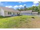 Green backyard featuring a grill, patio seating, and a fire pit at 122 Desurrency Ct., Georgetown, SC 29440
