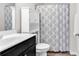 Clean bathroom featuring a shower-tub, storage cabinet, and a single sink vanity at 122 Desurrency Ct., Georgetown, SC 29440