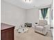 A peaceful bedroom with a comfortable armchair and lots of light at 122 Desurrency Ct., Georgetown, SC 29440