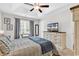 Comfortable bedroom with tray ceilings, stylish furnishings, and a television at 122 Desurrency Ct., Georgetown, SC 29440