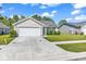 Charming single-story home featuring a two-car garage, well-maintained lawn, and inviting curb appeal at 122 Desurrency Ct., Georgetown, SC 29440