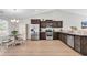 Open kitchen features stainless appliances, wooden cabinets, and an eat-in dining area at 122 Desurrency Ct., Georgetown, SC 29440