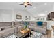 Spacious living room featuring an open layout, vaulted ceiling and a comfortable sofa at 122 Desurrency Ct., Georgetown, SC 29440