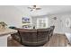 Bright living room featuring vaulted ceiling and views of the front entry and kitchen at 122 Desurrency Ct., Georgetown, SC 29440