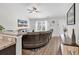 Bright living room features a vaulted ceiling and transitions to the kitchen and breakfast areas at 122 Desurrency Ct., Georgetown, SC 29440