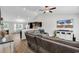 Well-lit living room with vaulted ceiling and a view into the breakfast area and kitchen at 122 Desurrency Ct., Georgetown, SC 29440