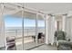 Lovely ocean view from the balcony with white curtains and a beach view in the background at 1401 S Ocean Blvd. # 506, North Myrtle Beach, SC 29582