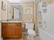 Well-lit bathroom with a granite vanity, decorative fixtures, and a shower-tub combo for convenience at 1401 S Ocean Blvd. # 506, North Myrtle Beach, SC 29582