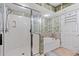 Bathroom with a glass-enclosed shower and a separate soaking tub at 1401 S Ocean Blvd. # 506, North Myrtle Beach, SC 29582