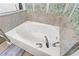 Close-up of a pristine white soaking tub with jets and chrome fixtures at 1401 S Ocean Blvd. # 506, North Myrtle Beach, SC 29582