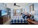 Well-lit bedroom with a large bed, ceiling fan, television, and balcony access at 1401 S Ocean Blvd. # 506, North Myrtle Beach, SC 29582