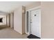 Condo entrance featuring a unit number 506 and neutral-colored walls with a modern light fixture at 1401 S Ocean Blvd. # 506, North Myrtle Beach, SC 29582