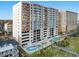 High-rise building with a pool, beachfront amenities, and multiple balconies for picturesque ocean views at 1401 S Ocean Blvd. # 506, North Myrtle Beach, SC 29582