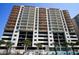 Modern condo tower featuring balconies, parking garage, and a refreshing outdoor swimming pool at 1401 S Ocean Blvd. # 506, North Myrtle Beach, SC 29582