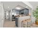 Well-equipped kitchen with stainless steel appliances and bar seating that leads into the living/dining area at 1401 S Ocean Blvd. # 506, North Myrtle Beach, SC 29582