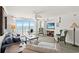 Inviting living room with ceiling fan, comfortable seating, and access to a balcony with an ocean view at 1401 S Ocean Blvd. # 506, North Myrtle Beach, SC 29582