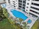 Bright blue pool with surrounding palm trees and a tanning deck at 1401 S Ocean Blvd. # 506, North Myrtle Beach, SC 29582