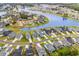Aerial view of neighborhood homes surrounding a scenic lake and lush landscaping at 143 Starlit Way, Myrtle Beach, SC 29579
