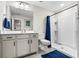 Bright bathroom with shower, single vanity and framed mirror at 143 Starlit Way, Myrtle Beach, SC 29579