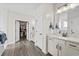 Bathroom features a double vanity, walk-in closet, and modern fixtures at 143 Starlit Way, Myrtle Beach, SC 29579