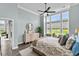 Bright bedroom with tranquil pond views and sitting area at 143 Starlit Way, Myrtle Beach, SC 29579