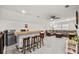 Spacious bonus room features a bar, comfortable seating, and a mini-fridge at 143 Starlit Way, Myrtle Beach, SC 29579