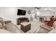 Spacious bonus room with comfortable seating, a TV, an electric fireplace, and a bar area at 143 Starlit Way, Myrtle Beach, SC 29579