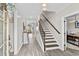 Inviting foyer with hardwood floors, a staircase, and access to the living areas at 143 Starlit Way, Myrtle Beach, SC 29579