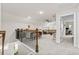 A large loft area with a bar, railing, seating, and adjacent rooms for flexible living at 143 Starlit Way, Myrtle Beach, SC 29579