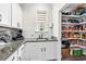A well-stocked pantry adjoins a kitchenette area at 143 Starlit Way, Myrtle Beach, SC 29579