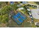 Aerial view of outdoor pickleball courts surrounded by trees, with parking and a volleyball court at 143 Starlit Way, Myrtle Beach, SC 29579