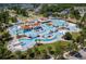 Aerial view of a resort-style community pool with multiple pools, lounging areas, and landscaping at 143 Starlit Way, Myrtle Beach, SC 29579