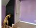 Purple bedroom featuring a reading area painted on the wall and a stuffed giraffe at 1440 Brighton Ave., Myrtle Beach, SC 29588