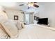 Bright bedroom featuring ceiling fan, TV, and natural light at 146 Stillwood Dr. # 3, Pawleys Island, SC 29585