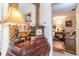 Entryway features a detailed wooden dresser, a decorative clock, and a view to the bedroom at 146 Stillwood Dr. # 3, Pawleys Island, SC 29585