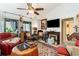 Comfortable living room with vaulted ceilings, fireplace, ceiling fan, and an ornate area rug at 146 Stillwood Dr. # 3, Pawleys Island, SC 29585