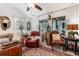 Comfortable living room with vaulted ceilings, large windows, a ceiling fan, and an ornate area rug at 146 Stillwood Dr. # 3, Pawleys Island, SC 29585